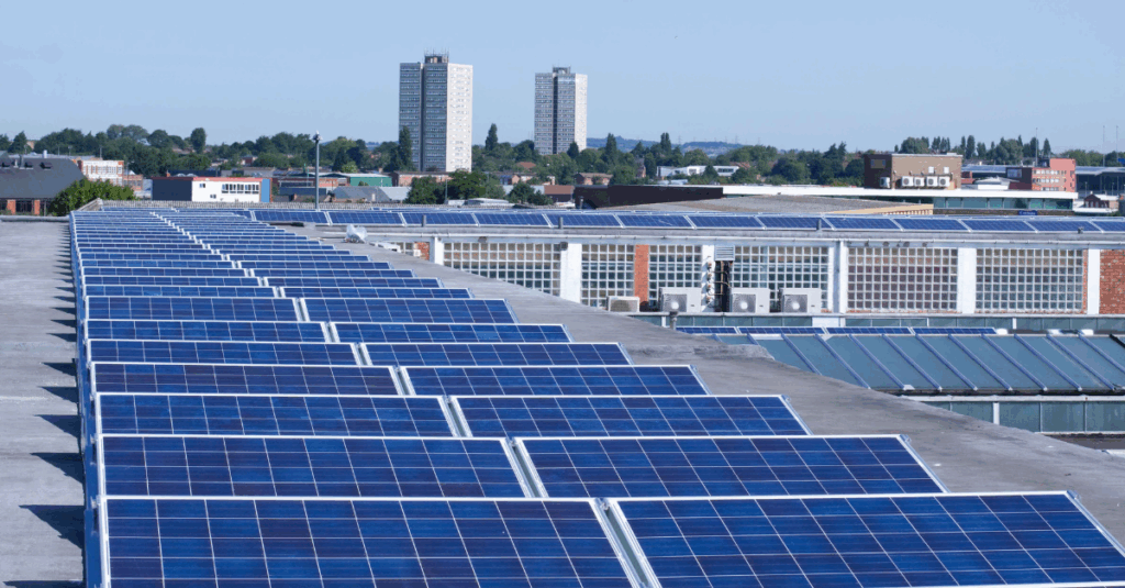 Commercial solar panel array installed on flat rooftop to support building energy efficiency goals