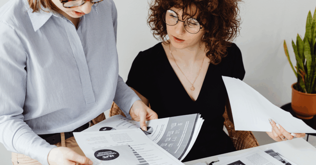employees reviewing paperwork